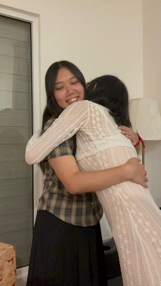 Niara hugs her friends